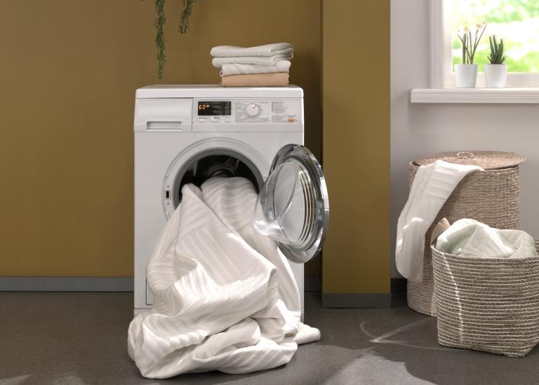 Washing machine with cleanable mattress fabric inside.